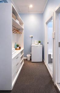 a bathroom with a sink and a toilet in a room at Zen Hostel in Townsville