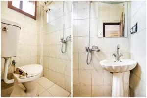 a bathroom with a toilet and a sink at Hotel O by OYO Angad Continental in Ambāla +50 photos
