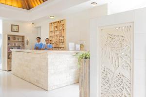 two people standing at a counter in a room at Artemis Villa Hotel in Seminyak +169 photos