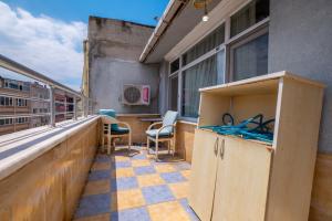 a balcony with a table and chairs on a building at suites beyazıt in Istanbul