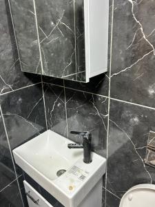 a bathroom with a sink and a mirror at suites beyazıt in Istanbul +21 photos