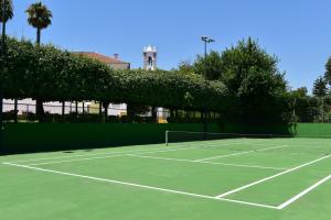 a tennis court with a tennis racket on it at Pousada Convento de Beja in Beja