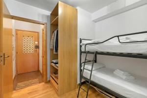 a small room with a bunk bed and a door at Studio Valleverde 26B - Happy Rentals in Sestriere