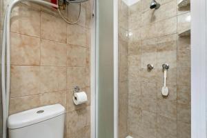 a bathroom with a toilet and a shower at Studio Valleverde 26B - Happy Rentals in Sestriere +12 photos