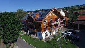 an overhead view of a house with solar panels on it at Landhof Müller in Wertach