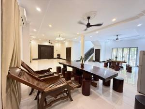 a large living room with a table and chairs at Thida Villa in Siem Reap