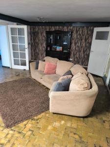 a living room with a couch and a rug at Ferienwohnung Viktoria in Ehrlich