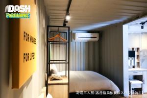 a room with a bed and a shelf in a room at Dash Forwaves Hotel in Toucheng +75 photos