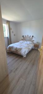 a bed in a bedroom with a wooden floor at Residence Mara Dea in Galeria +25 photos