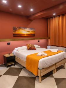 a bedroom with two beds and a painting on the wall at Arena Albaro House in Genoa +71 photos
