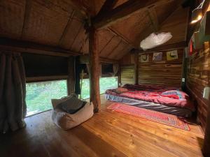 a room with two beds in the inside of a train at Pam Hill in Bản Pha Xum