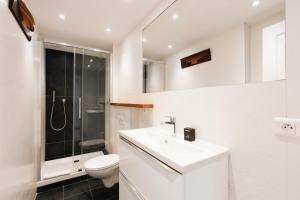 a bathroom with a toilet and a sink and a shower at Mer du Sud 4 YourHostHelper in Cannes +23 photos