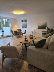 a living room with a couch and a table at Blick zur Burg in Nörten-Hardenberg
