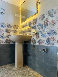 a bathroom with a sink and a mirror at Mount Vista Homestay Kandy in Kandy