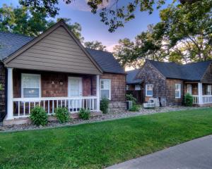 a home with a house with a yard at Aggie Inn, an Ascend Collection Hotel in Davis