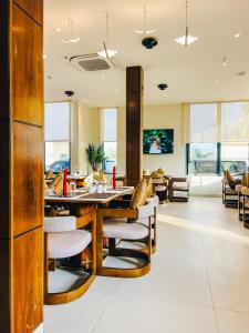a dining room with a table and chairs at Zabibu Hotel in Dodoma