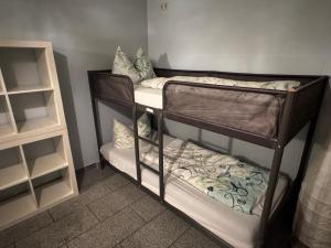 two sets of bunk beds in a room at Bauernhof Privatzimmer Free WiFi Gemeinschaftsbad in Hausbreitenbach