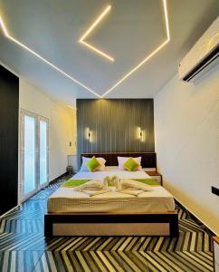 a bedroom with a large bed in a room at West wind Resort in Meppādi