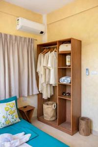 a room with a wardrobe and a bed and a window at Kalija in General Luna