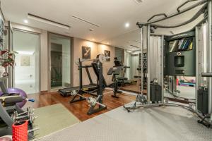 a gym with several exercise equipment in a room at Villa Skyfall Thailand Phuket in Panwa Beach