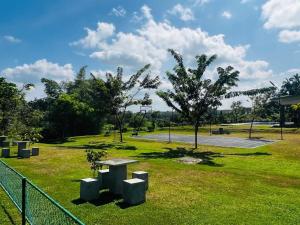 a park with a picnic table in the grass at Apartment For Rent in Ambulgama