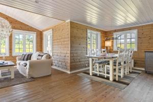 a living room with a couch and a table at Solsiden 16B by Vacation Trysil in Trysil