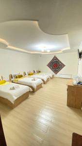 a room with a row of beds in it at Samarkand Сity Guest House in Samarkand +230 photos
