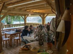a group of people sitting at a table in a restaurant at ZEcamping 3 étoiles piscine animaux acceptés in Montaut +30 photos