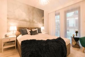 Postel nebo postele na pokoji v ubytování Kings City - Skawińska Apartment