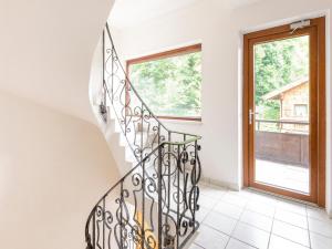 a spiral staircase in a house with a window at Property in Kirchbichl in Kirchbichl