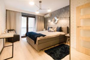 Posteľ alebo postele v izbe v ubytovaní Kings City - Skawińska Apartment