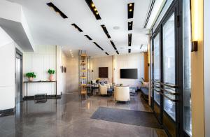 an office lobby with a waiting area and a tv at Me by Mula in Istanbul
