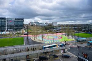 a city with a playground and a bus at Station Gold Leaf - Gym - Games Room - MK in Milton Keynes