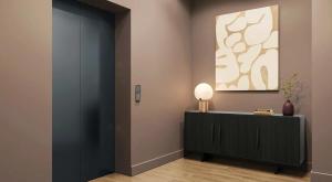 a room with a black cabinet and a painting at Nester Finn St Lawrence Market in Toronto