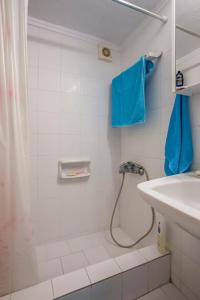a bathroom with a shower and a sink at Onar holiday home in Fourka +15 photos