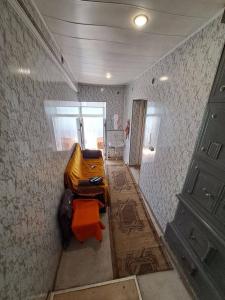 a room with a bed in the corner of a room at Riverside Hostel in Gyumri
