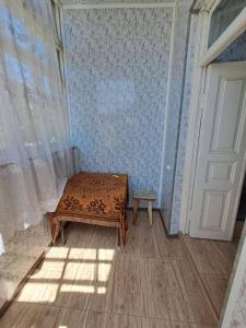 a room with a bed in a room with a door at Riverside Hostel in Gyumri