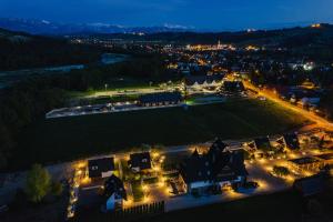an aerial view of a town at night at Osada Białka Tatrzańska - apartamenty & domki z ogrodem dla rodzin, Odkryj-Bialke in Białka Tatrzańska