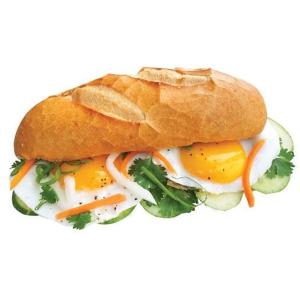 a sandwich with eggs and vegetables on a plate at THANH XUAN Hotel in Sapa