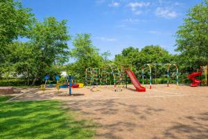 a playground with a bunch of play equipment in a park at Prakash Nilayam Studio I - Kondapur in Lingampalli