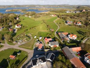an aerial view of a village with houses and a lake at Toftenäs apartment in Toftenäs