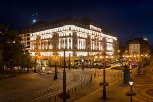a large building with lights on in a city at night at Radisson Blu Carlton Hotel, Bratislava in Bratislava