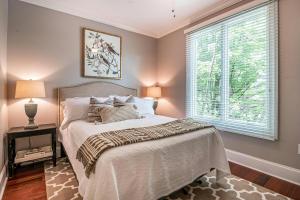 a bedroom with a bed and a window at Hotel Claytone Near Delhi Airport in New Delhi +21 photos