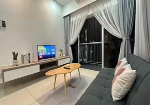 a living room with a couch and a table at K&L Suites Razak City Kuala Lumpur in Kuala Lumpur