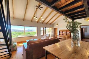 a living room with a couch and a table at Pekárna in Vosburg +9 photos