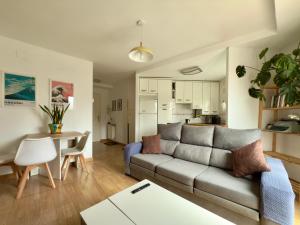 a living room with a couch and a table at La Encarnación in Ávila