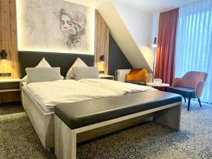 Gulta vai gultas numurā naktsmītnē Hotel Dreyer Garni