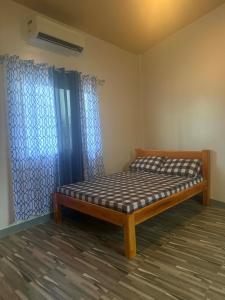 a bedroom with a bed in a room at New Apartment in Panglao Island