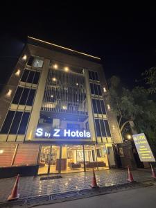 a building with a sign that reads sz hotels at S by Z Hotels, Baani Square in Gurgaon