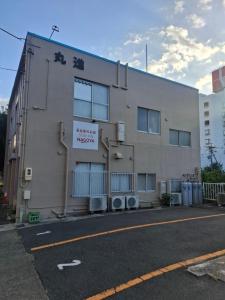 a building on the side of a street at 駐車場無料 名古屋のお宿 STAY INN NAGOYA Free Car Park 大型車要相談 in Nagoya +38 photos